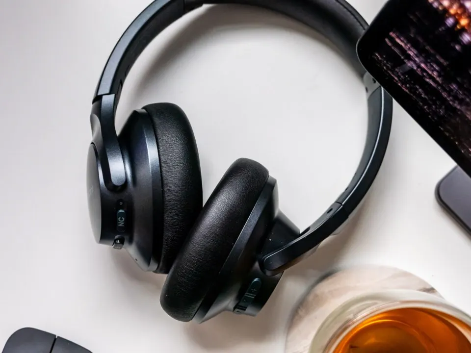 A headset resting on a desk, ready for an interpretation call.